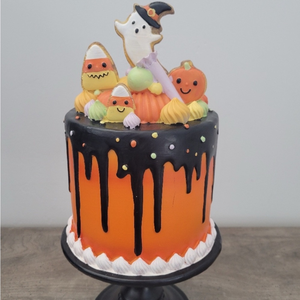 Halloween Drip Cake with Ghost and Candy Decorations